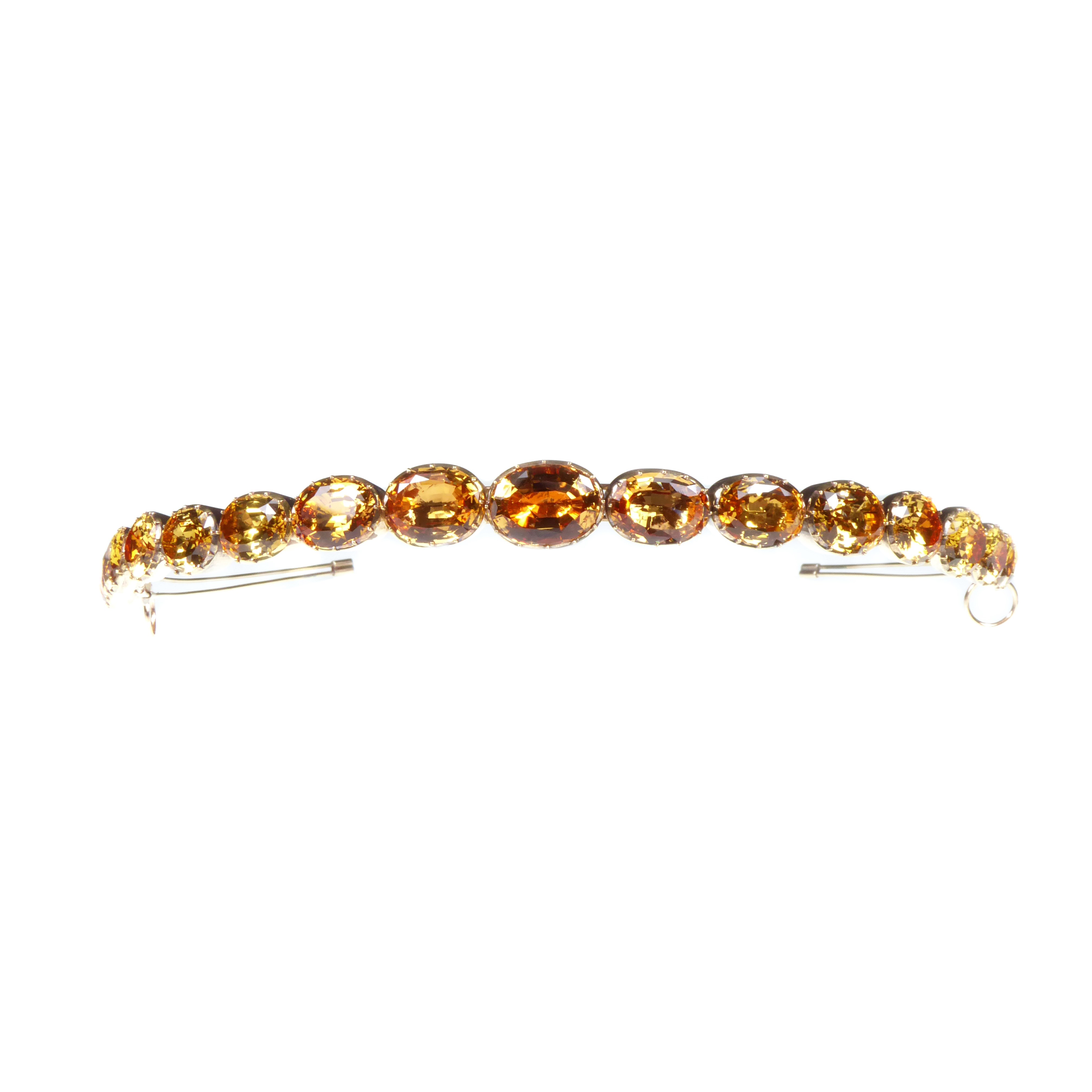 Antique graduated golden topaz collets as a bandeau, formerly belonging to Gloria, the late Dowager Countess Bathurst, converted probably from bracelets,